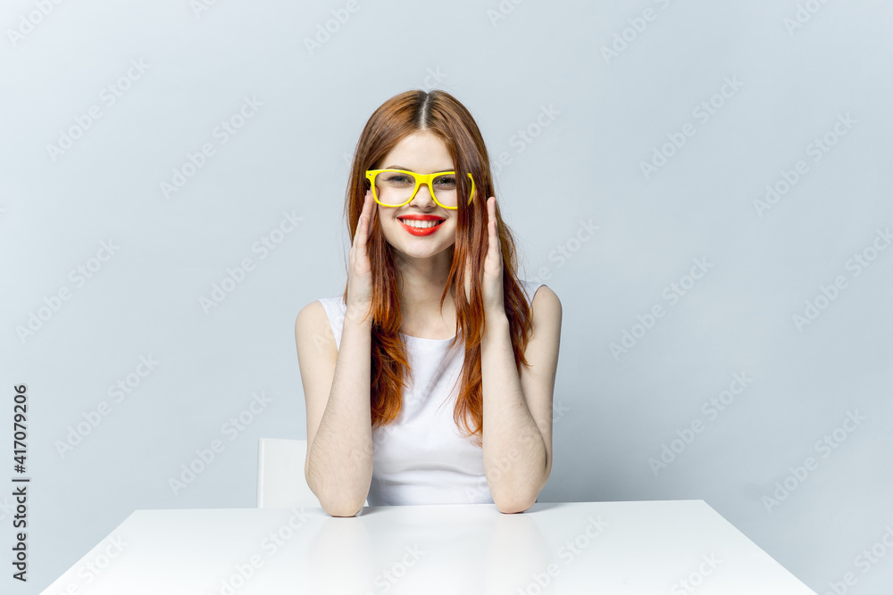 cheerful red-haired woman yellow glasses smile red lips cheerful red-haired woman yellow glasses smile red lips