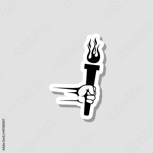 Hand with flaming torch sticker icon