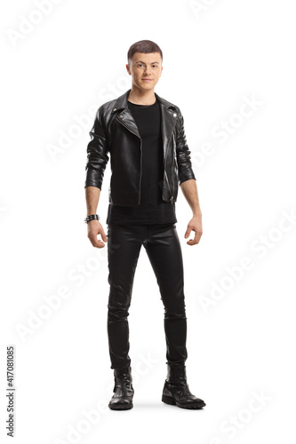 Bild auf Leinwand Full length portrait of a teenage male in leather jacket and pants posing