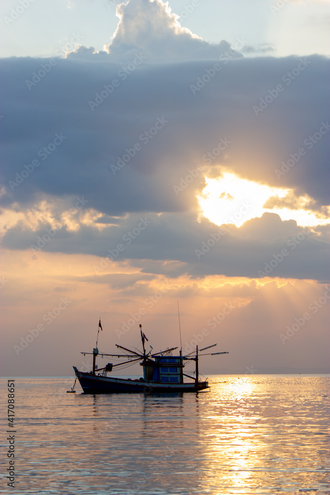 boat in the sunset,Fishing boats at sunset, Bang Lamung, Chon Buri, Thailand