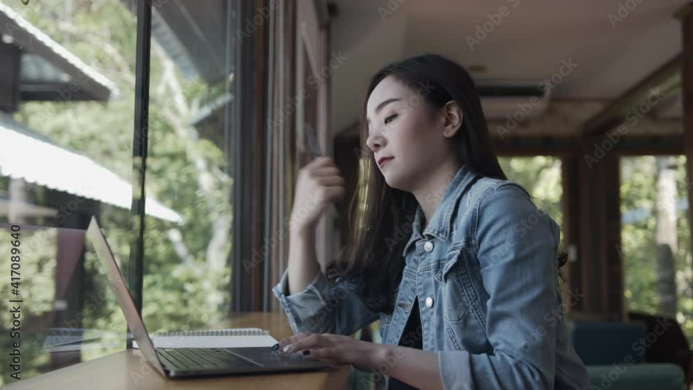 Business woman typing, searching and checking document in modern cafe. Business woman typing, searching and checking document in modern cafe.
