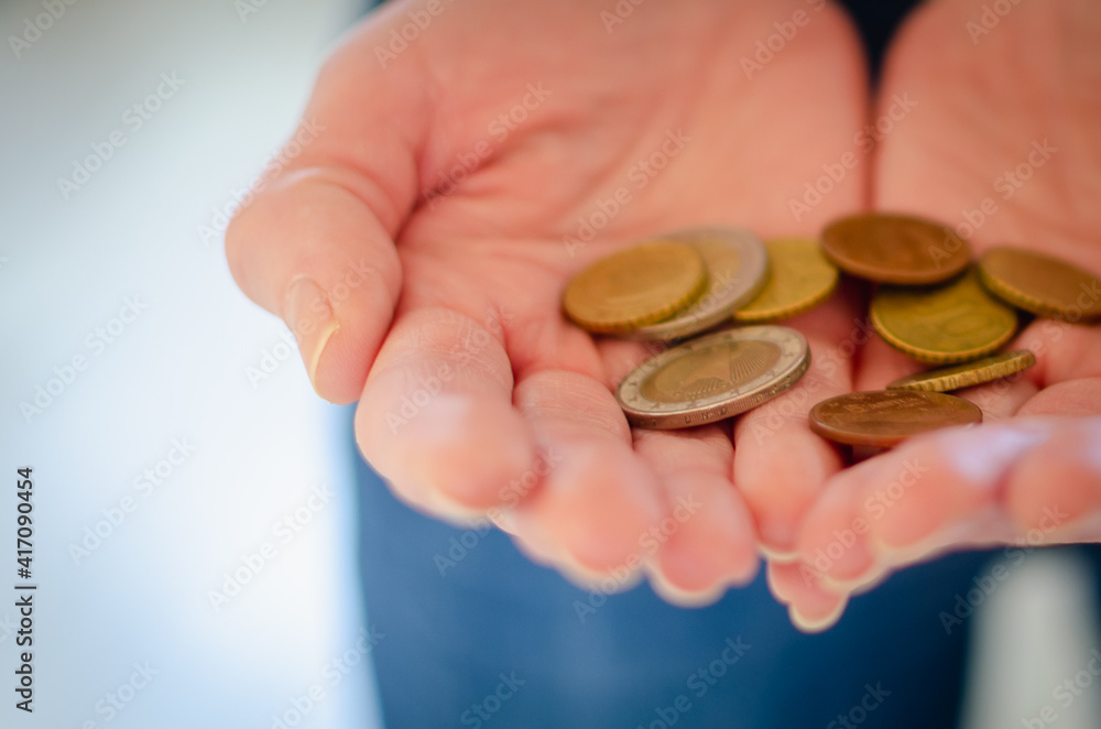 Small metal money in hand. Small metal money in hand.