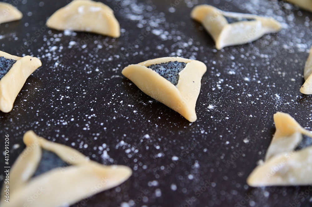 Hamantash cookies preparation for Purim Jewish holiday Hamantash cookies preparation for Purim Jewish holiday