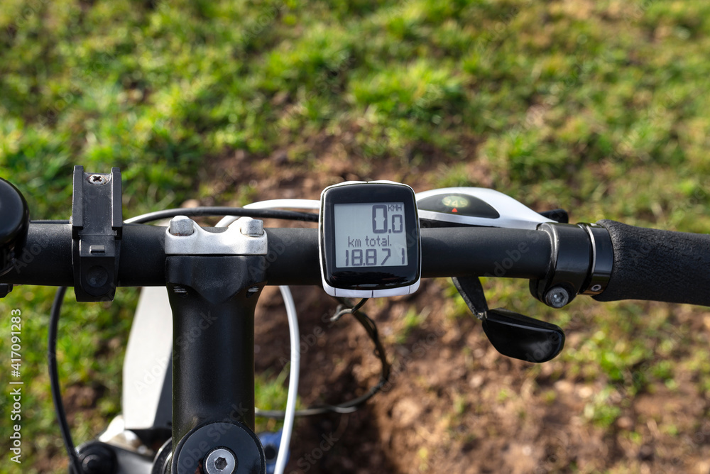 Bicycle electric counter mounted on the handlebar of a mountain bike, top view. Bicycle electric counter mounted on the handlebar of a mountain bike, top view.