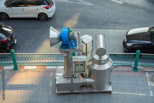 The Water spray robot for treatment the air from PM 2.5. JET VENTURI SCRUBBER ERIG. Ginormous Air Purifier machine installed on footpath in Bangkok, Thailand.. photo