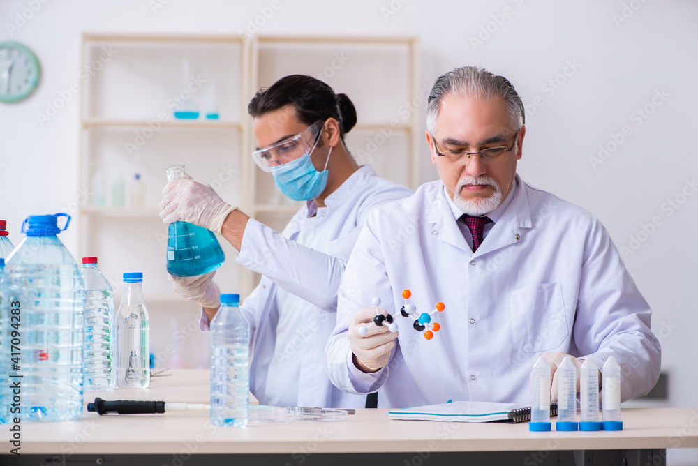 Two chemists working in the lab