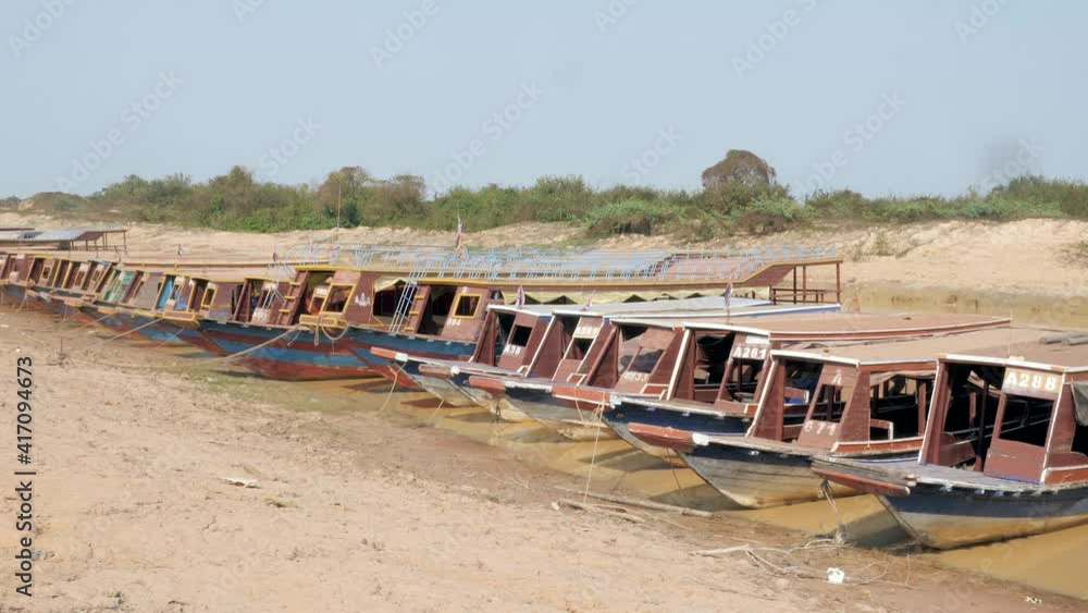 side view of tourist boats parked at the riverbank side view of tourist boats parked at the riverbank