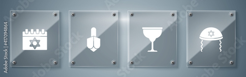 Set Jewish kippah, goblet, Hanukkah dreidel and calendar. Square glass panels. Vector.