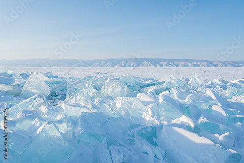Winter Baikal lake landscape with Sun on blue sky.