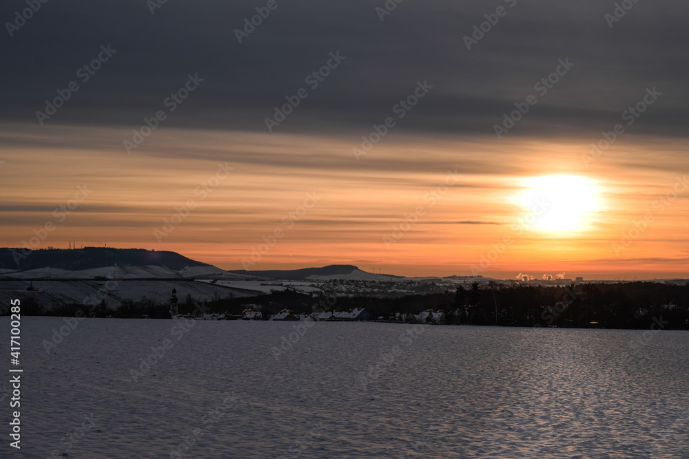 Naklejka premium sunrise over the Snow field 