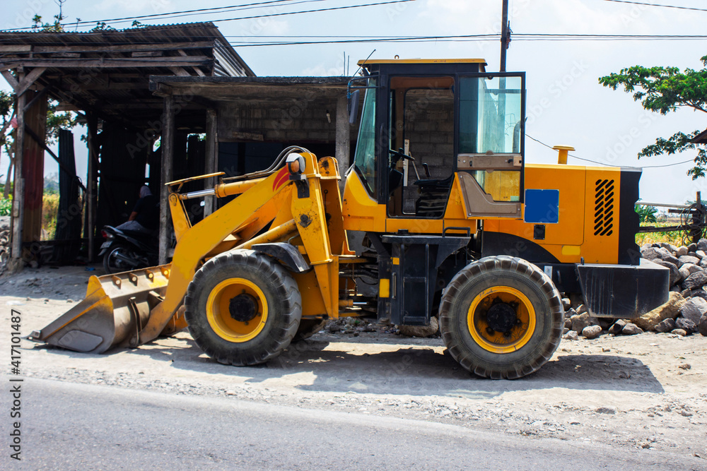Grader and yellow bulldozer excavator Construction Equipment with clipping on street