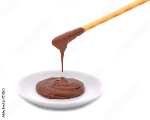 Breadsticks dipped in chocolate cream isolated on white
