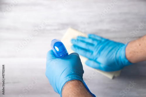 Cleaning surfaces with an antiseptic during a coronavirus epidemic.