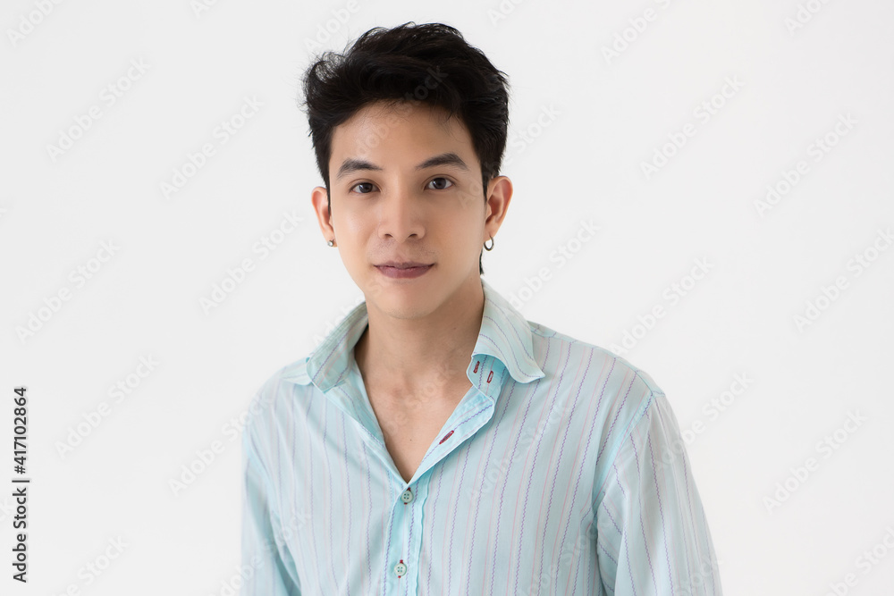 Young and handsome teenage black hair Asian man wearing earrings on white background Young and handsome teenage black hair Asian man wearing earrings on white background
