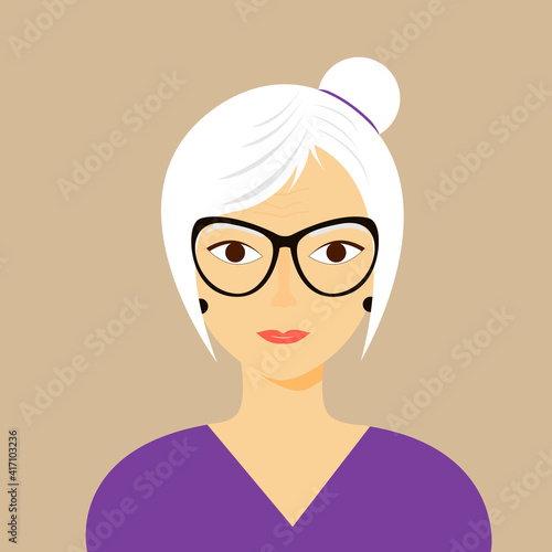 An attractive older woman with gray hair pulled back in a bun