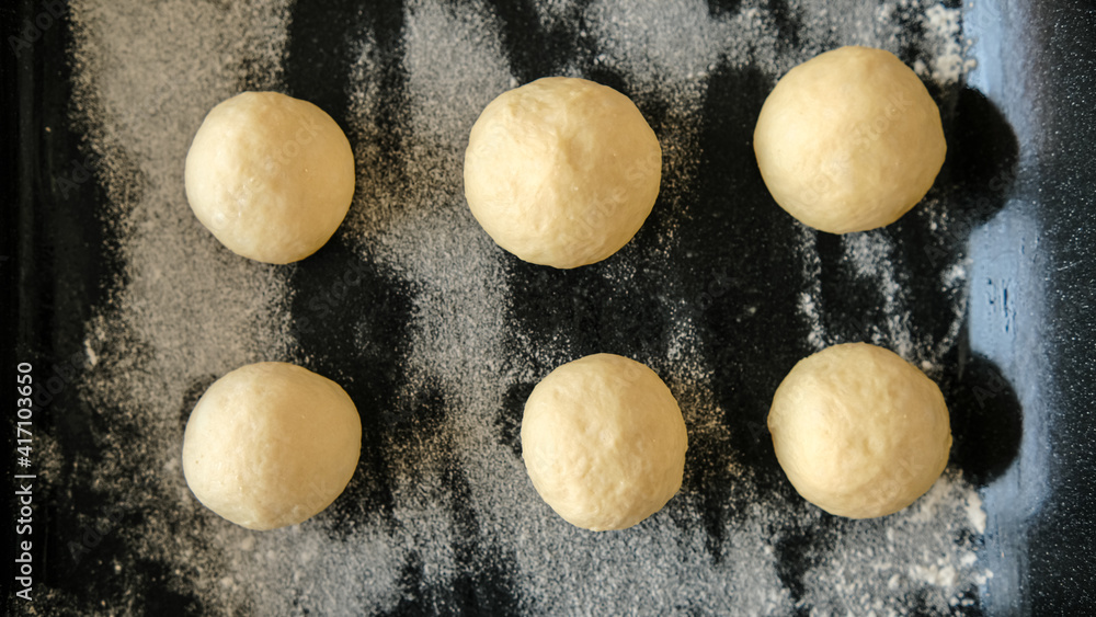 Close-up of raw dough for buns, cakes. On the wick. Flour products. Gluten free Close-up of raw dough for buns, cakes. On the wick. Flour products. Gluten free