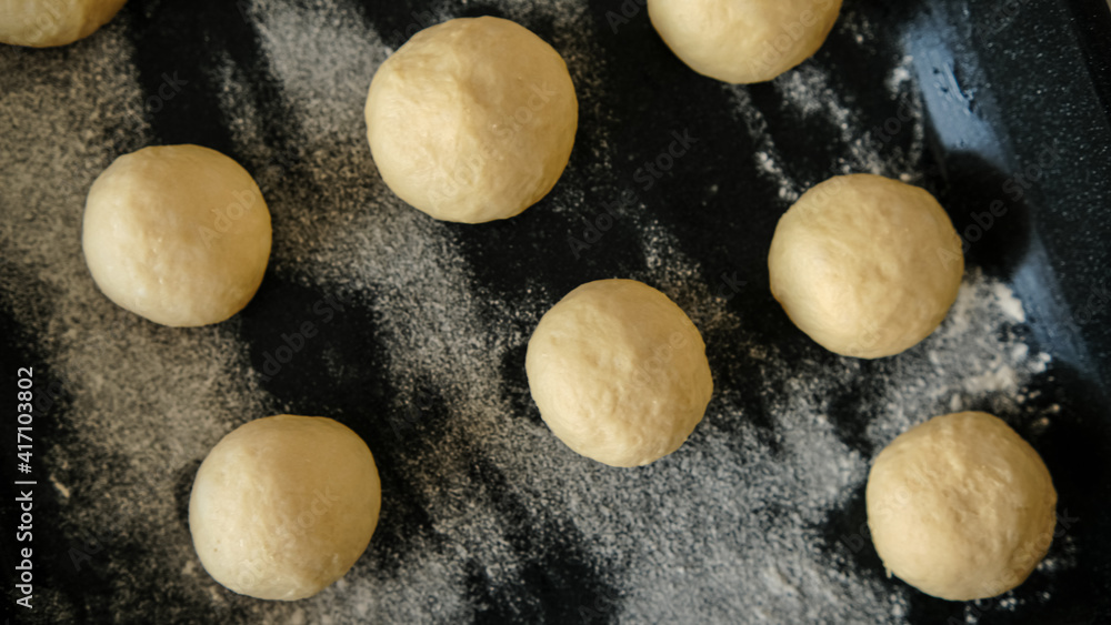 Close-up of raw dough for buns, cakes. On the wick. Flour products. Gluten free Close-up of raw dough for buns, cakes. On the wick. Flour products. Gluten free