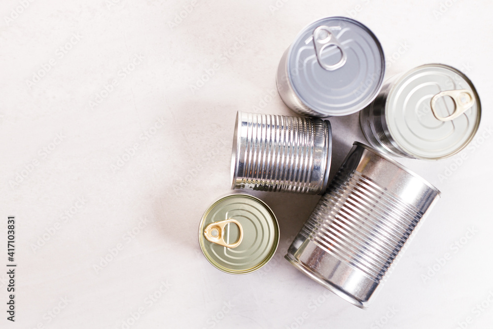 Various canned vegetables on kitchen table background. Various canned vegetables on kitchen table background.