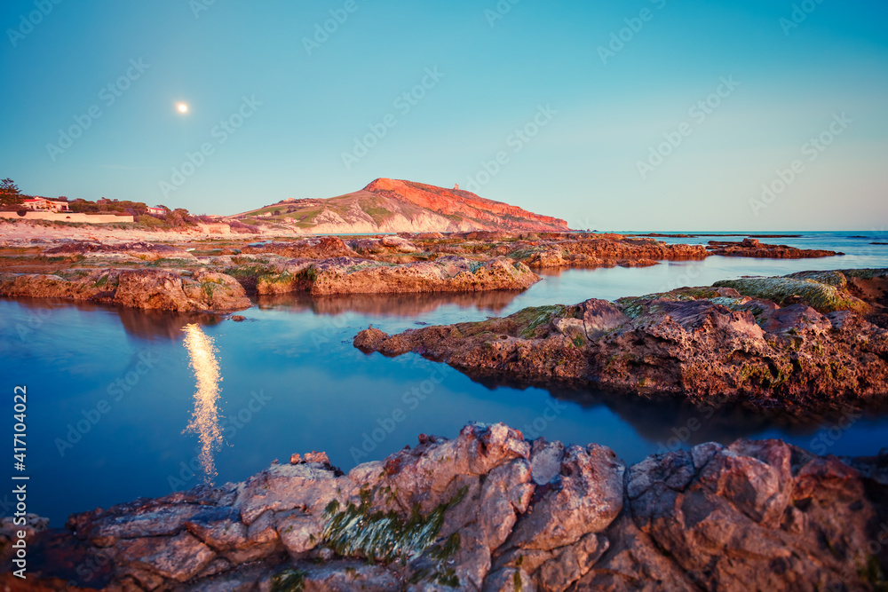 Wonderful volcanic shore in the moonlight. Location south coast of island Sicily, Italy, Europe.