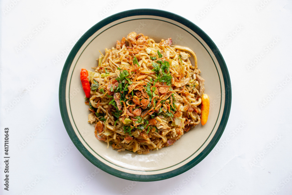 Mie Goreng Jawa or bakmi jawa or java noodle with spoon and fork ...