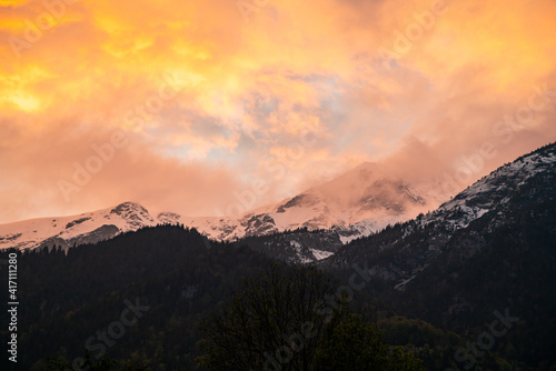 Sunset over snowcapped mountains