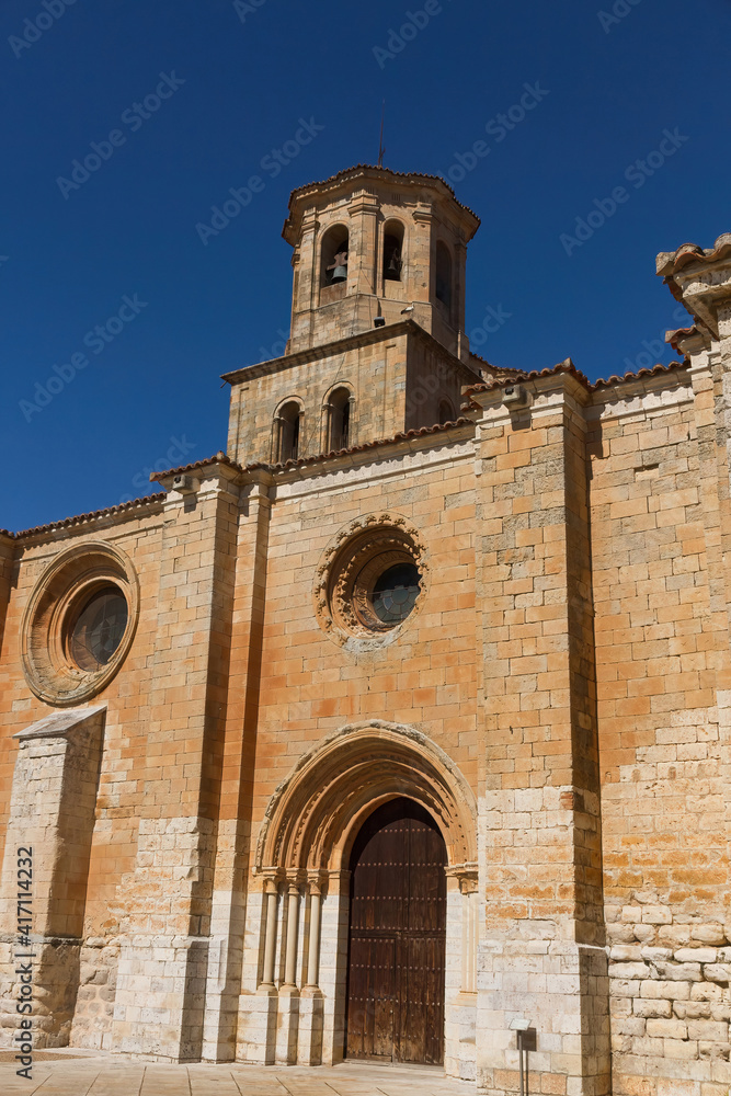 South door and church tower Collegiate of Toro (Colegiata de Santa María la Mayor) in Zamora, Spain 