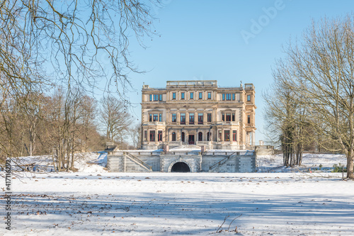 frozen river with a monumental building in the background