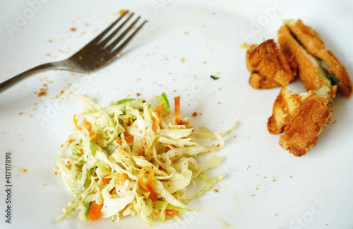 Tableau sur toile leftover food and fork on white plate