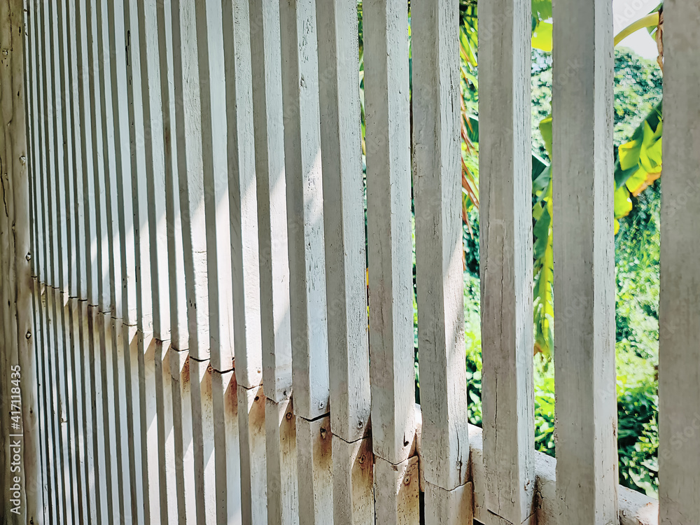 Perspective View of Row of White Wooden Bars Wall