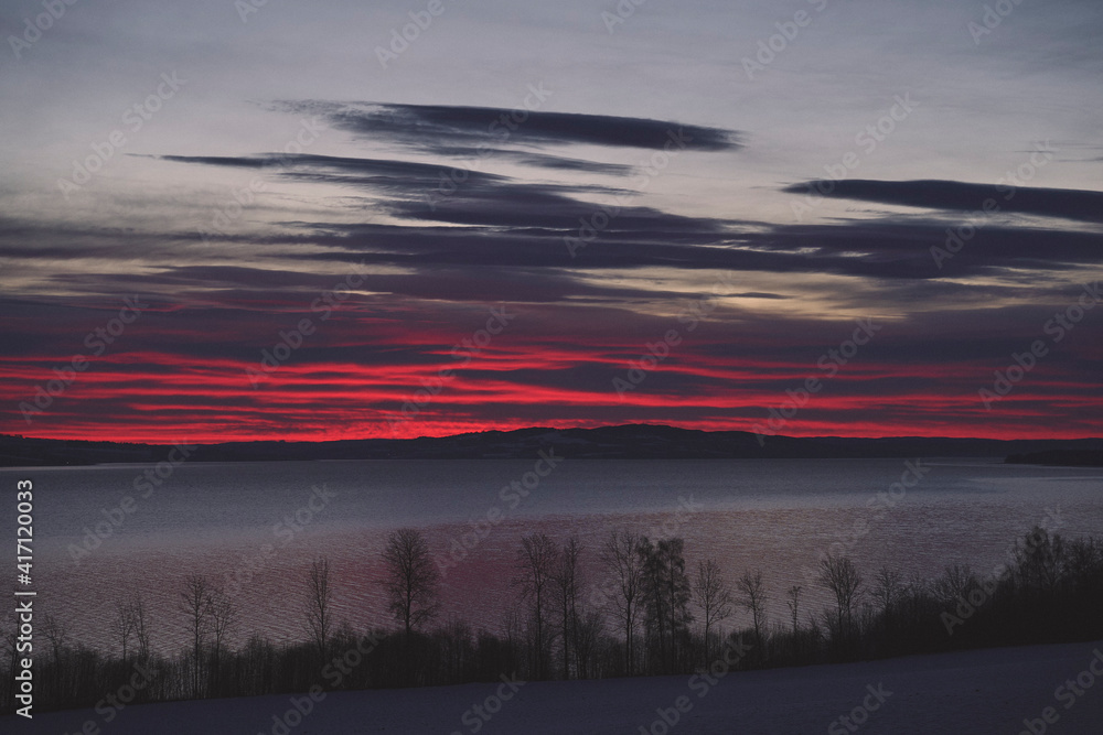 Fototapeta premium Helgøya Island in Lake Mjøsa at winter by sunrise.