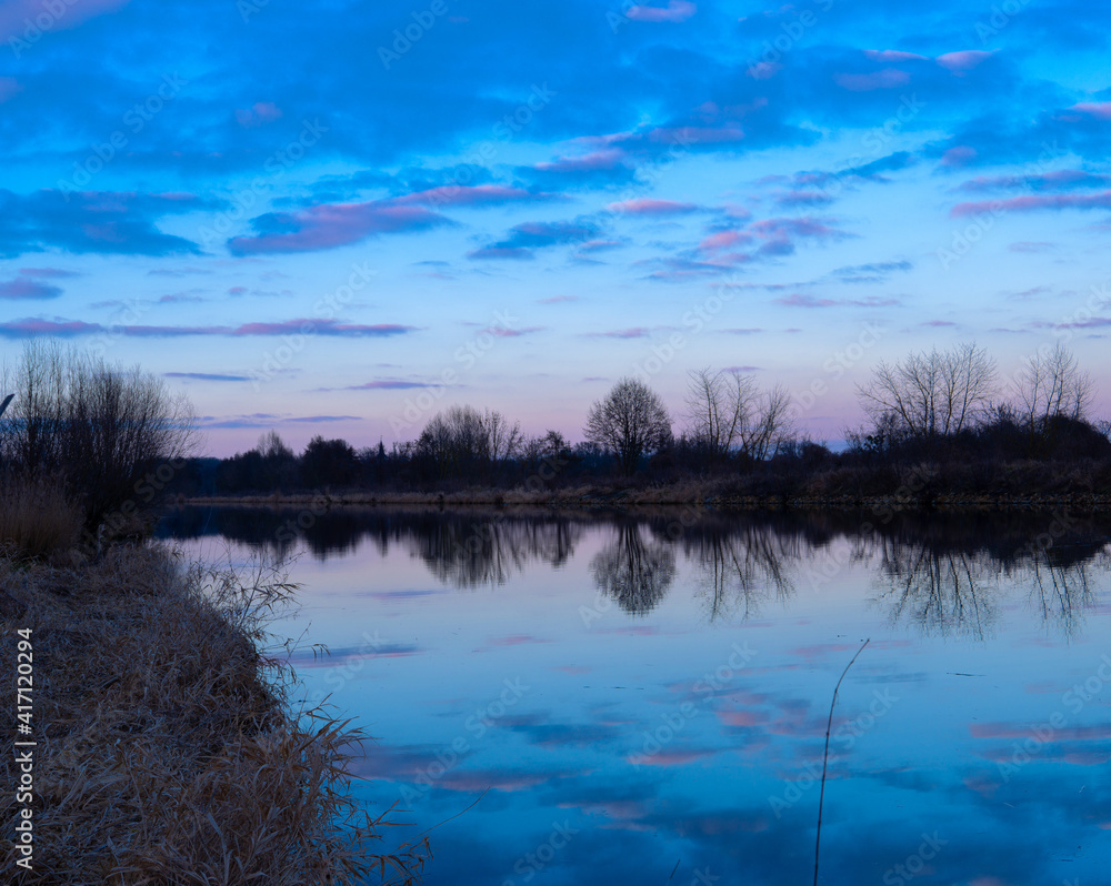 The reflection of colorful clouds in the water after sunset
The reflection of colorful clouds in the water after sunset
