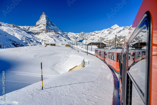 Taking a train from Zermatt to a peak Gornergrat. Matterhorn in the background. photo
