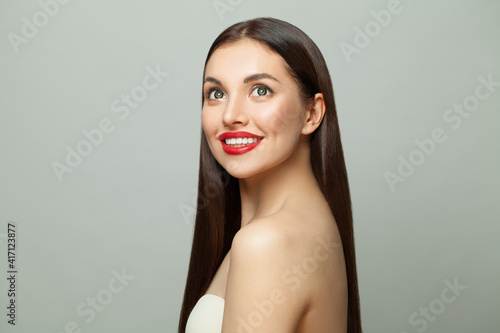 Healthy young model woman with clear skin and long healthy straight hair. Skincare and facial treatment concept