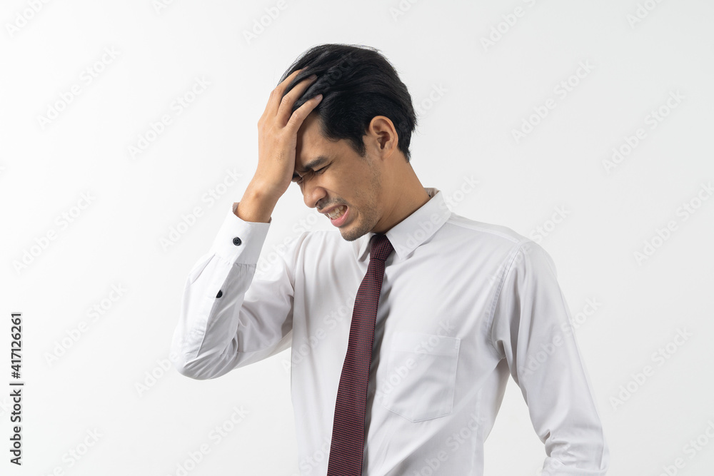 asian young businessman have a headache isolated on white background asian young businessman have a headache isolated on white background