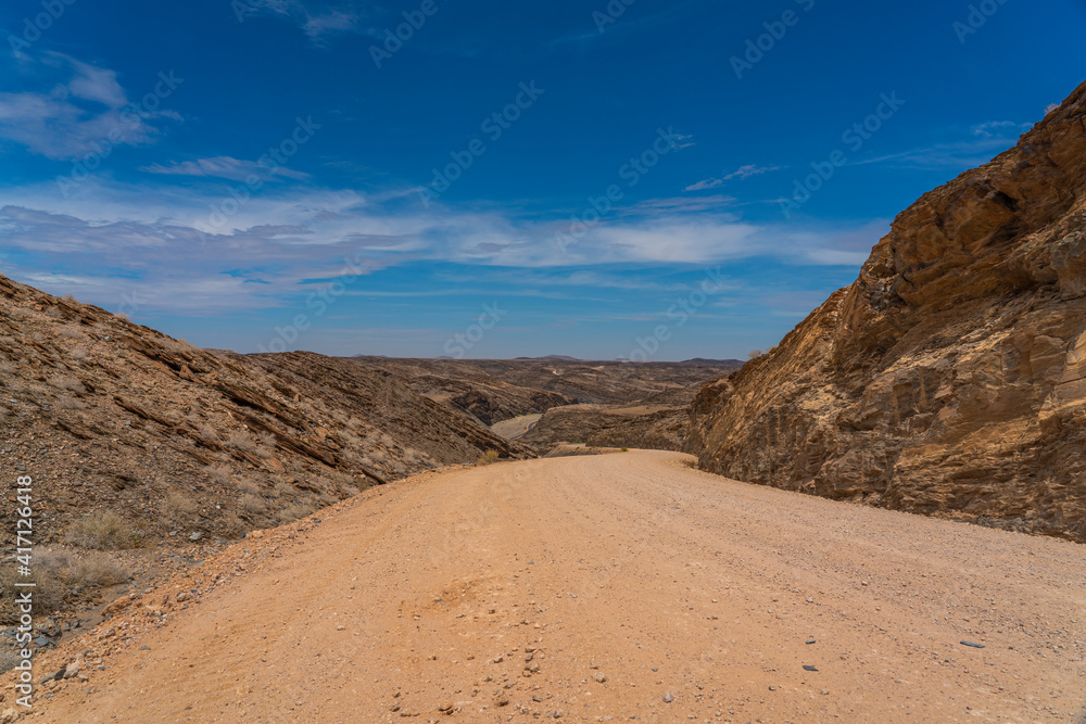 Landscape with road at Namib-Naukluft National Park , s a national park of Namibia, background blue sky