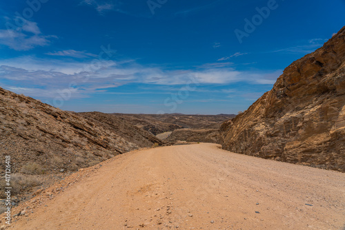 Landscape with road at Namib-Naukluft National Park , s a national park of Namibia, background blue sky