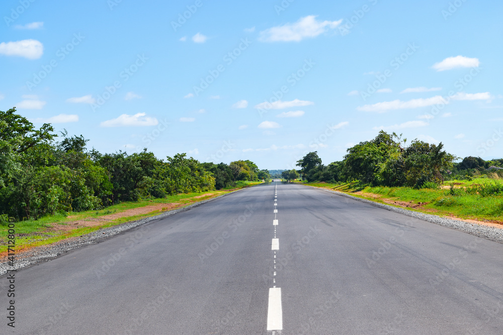 An empty highway against sky in rural Malawi