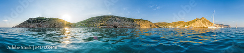 Scenic panoramic view of Balaclava bay with yachts from the ruines of Genoese fortress Chembalo. Balaklava, Sevastopol, Crimea. Inspirational travel landscape. Aerial photo. Copy space. photo