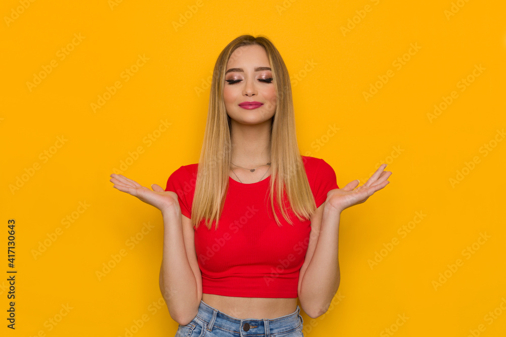 Young Woman Holds Her Hands Up And Meditates Young Woman Holds Her Hands Up And Meditates