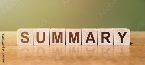 Photos SUMMARY word written on wooden blocks on wooden table