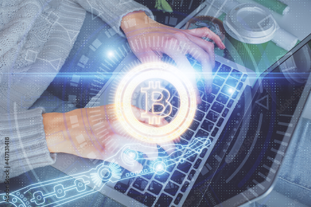 Double exposure of woman hands typing on computer and crypto market theme hologram drawing. Blockchain concept. Double exposure of woman hands typing on computer and crypto market theme hologram drawing. Blockchain concept.
