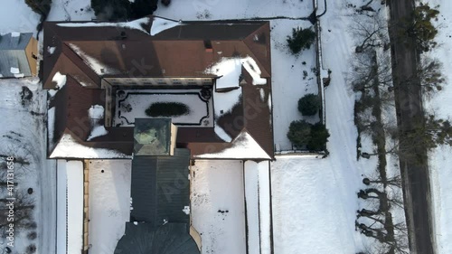 STOCZEK KLASZTORNY, POLAND - FEBRUARY 21, 2021: Monastery in Stoczek Klasztorny in Kiwity from drone above perspective during winter time. Monastery is mostly known from confinement of Cardinal Wyszyn photo