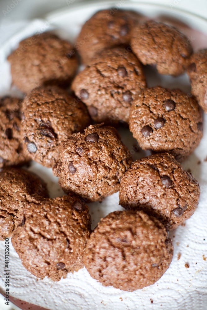 Organic homemade chips cookies with chocolate and cocoa. Close up and blurry view. Organic homemade chips cookies with chocolate and cocoa. Close up and blurry view.