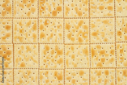 Schilderij op canvas Saltine crackers in rows background