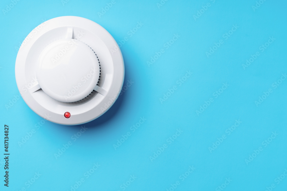 Smoke alarm on a blue background. Copy-space Smoke alarm on a blue background. Copy-space