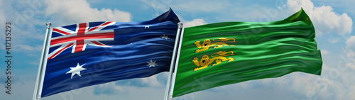 Dhekelia Garrison Flag and Australia Flag waving with texture Blue sky with clouds Double flag photo