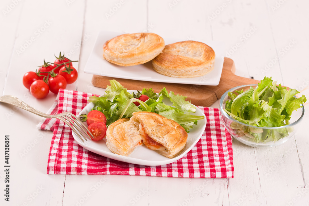 Puff pastry filled with tomato and mozzarella cheese. Puff pastry filled with tomato and mozzarella cheese.