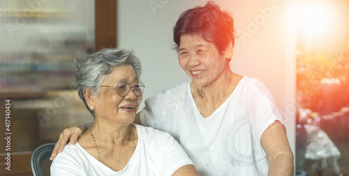 Happy senior society concept. Portrait of Asian female older ageing women smiling with happiness in garden at home, or wellbeing county