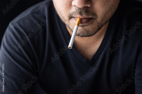 Young men are going to smoke He put a cigarette in his mouth. World No Tobacco Day.