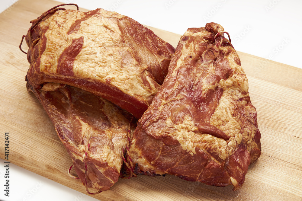 Fototapeta premium Meat delicacies on a light board